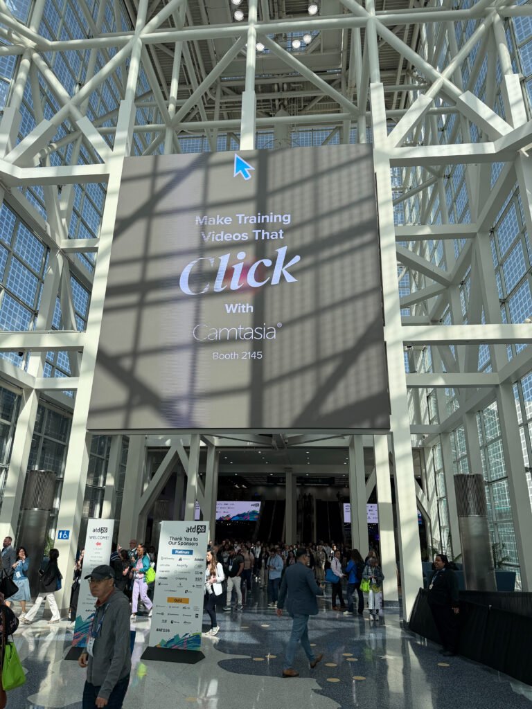 Camtasia DVD Cursor conference graphic displayed on a booth screen